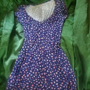 Blue dress with pink and white flowers. With a corset back tie